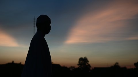 Silhouette Asian islam man prayer,Young Muslim praying,Ramadan festival concept