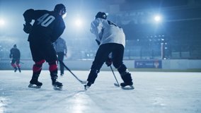 Ice Hockey Rink Arena: Professional Forward Player Attacks, Shows Expert Stickhandling, Dribbles, Handling Puck with Hockey Stick Beautifully, Defense Unable to Intercept. Tracking Wide Shot - Powered by Shutterstock - Get 15% off with code: PIKWIZARD15