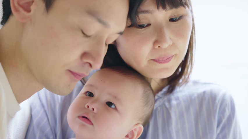 Asian parents and newborn baby. Child rearing concept. Royalty-Free Stock Footage #1075362470