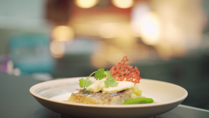 Close up Chef serve beautiful fish steak fine dining | Shutterstock HD Video #1075372124