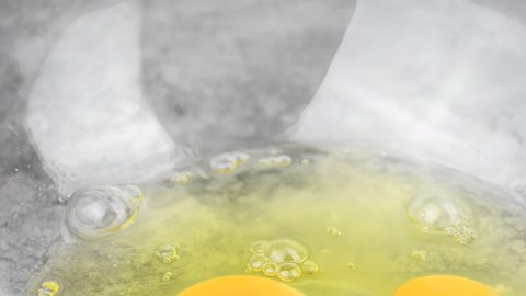  preparing raw egg cracked into glass bowl for cooking and baking 4k footage of fresh eggs