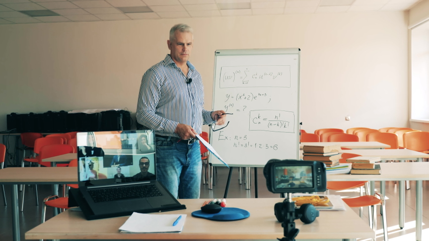 Male teacher is explaining formulas for online students. Online learning, online training, online education, remote working, distance learning, distance education, remote education concept.