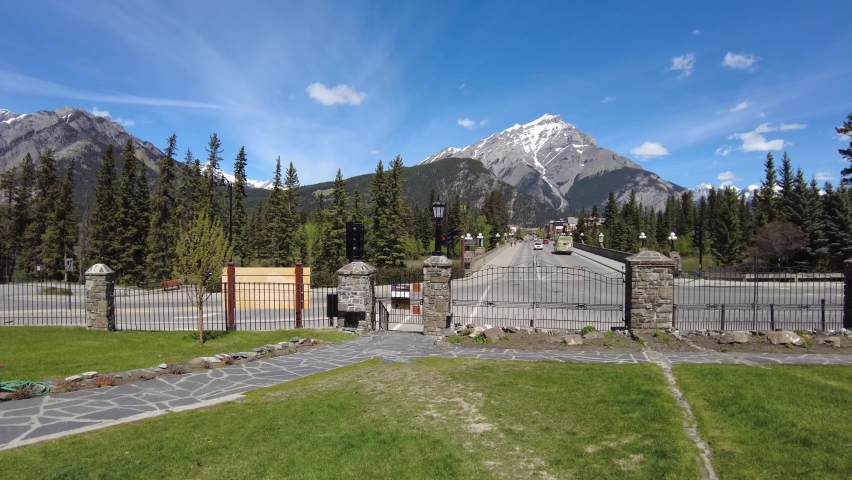 Empty Banff avenue with the view of the mountains at the back. Famous resort town near Calgary popular for hiking, biking, skiing, and camping located in Canadian Rocky Mountains 