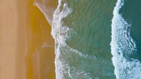 Aerial view of drone. Full frame of beach sand and sea. High Quality Nature Video Landscape Aerial View Beach Sea. On Good Weather Day In Summer Travel. Phuket travel trip Andaman sea On June 2021.