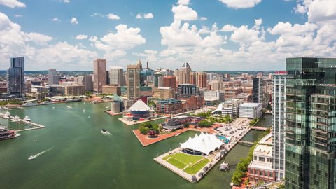 BALTIMORE - JULY 4, 2021: Aerial drone hyperlapse of Baltimore Inner Harbor and skyline. Baltimore is the most populous city in the U.S. state of Maryland