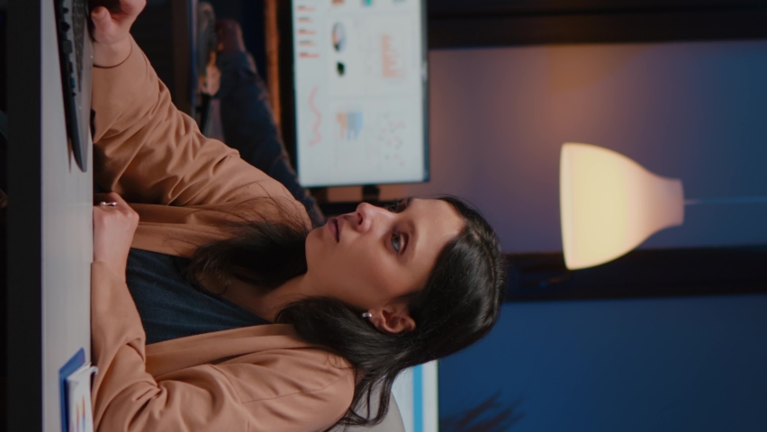 Happy cheerful businesswoman smiling while looking at laptop computer display receving winning corporate job promotion. newa Joyful happy executive manager working in company office late at night