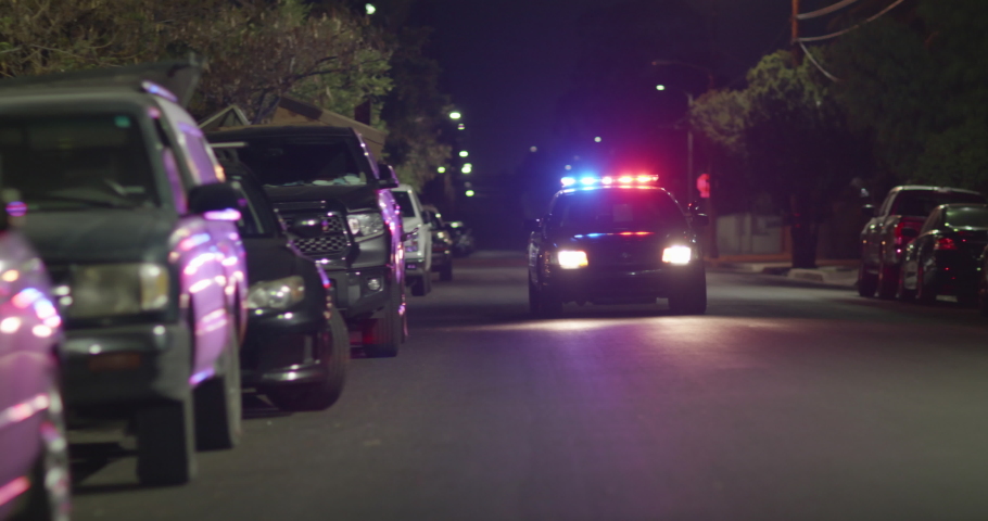 Police Car Canvasing Neighborhood At Night. Turns On Flashing Lights, Police Lights. Emergency, Speeds Off Fast | Shutterstock HD Video #1075449308