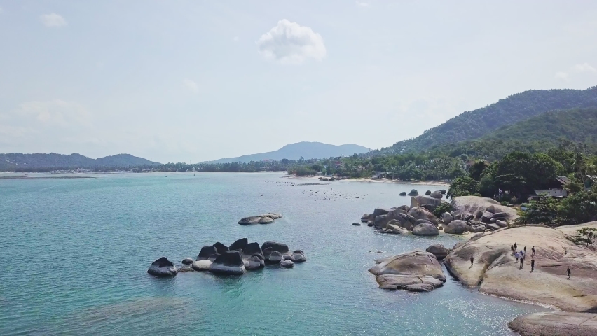 Epic Beach Rock Scene People walking Beautiful Island Koh Samui Thailand 4K Drone