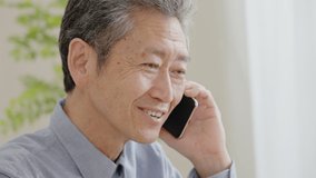 Senior man calling with a smile - Powered by Shutterstock - Get 15% off with code: PIKWIZARD15