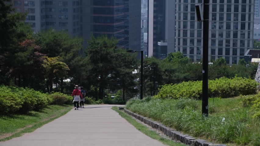 People and tourists walking and commuting in Namsan Park in Seoul, South Korea