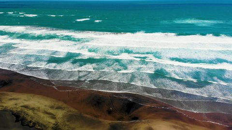 Stunning Piha Beach With Person Kite Boarding In New Zealand. - Aerial Drone Shot