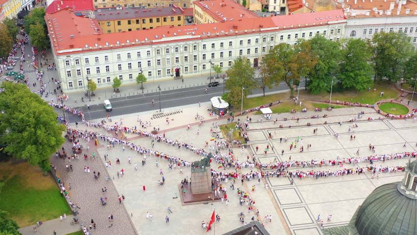 People Gathered To Unite In Celebrating The Road To Freedom Commemoration In Vilnius Cathedral Square In Lithuania. - Aerial Shot