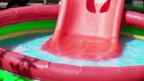 Children splashing and playing in swimming pool. Shoot on Digital Cinema Camera in slow motion-ProRes 422 codec.
