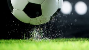 Super slow motion of falling soccer ball on lawn. Speed ramp effect. Filmed on high speed cinema camera, 1000fps. - Powered by Shutterstock - Get 15% off with code: PIKWIZARD15