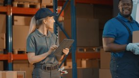 Female Manager Using Tablet Computer To Check Inventory, Smiles and Looks at Camera. Warehouse Retail Center with Cardboard boxes, e-Commerce Online Orders, Food. Frontline Hero. Slow Motion - Powered by Shutterstock - Get 15% off with code: PIKWIZARD15