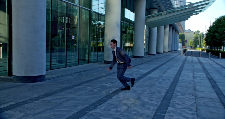 the man rushes to his favorite job and with joy makes somersaults to continue running in the background of the sun