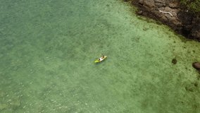 mother and her daughter kayaking in sunny day together in a tropical sea on her summer vacation holiday