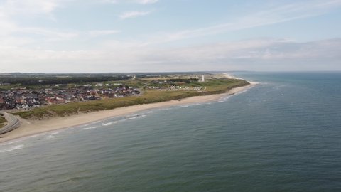 Aerial view from the sea of the coast line of Hirtshals, Denmark , with the lighthouse at the background
