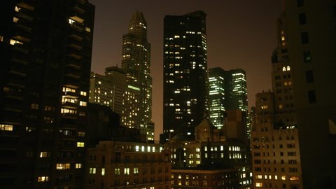 time lapse movie of a new york skyline as various lights in buildings are turned on and off