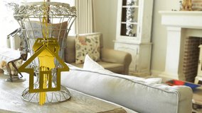 Animation of dangling house key and key fob over living room. new home, property and house ownership concept digitally generated video. - Powered by Shutterstock - Get 15% off with code: PIKWIZARD15