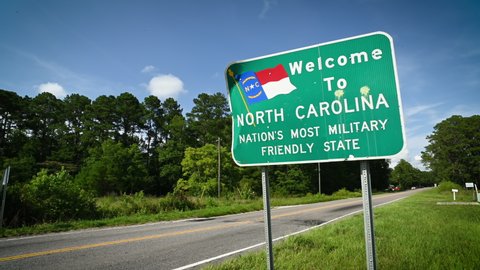 A sign welcomes travelers to the state of North Carolina.