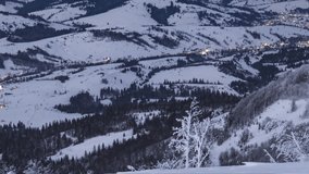 Night village in winter time lapse in Carpatian mountains, timelapse, UHD 4K video