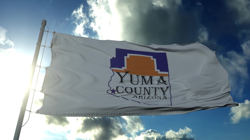 Yuma county flag, state of Arizona, United States of America waving at wind in blue sky