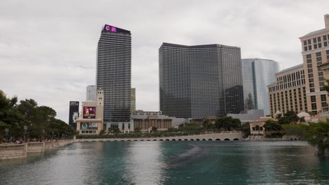 Las Vegas, Nevada - June 7, 2021: A view of the Bellagio water show and the Cosmopolitan hotel 