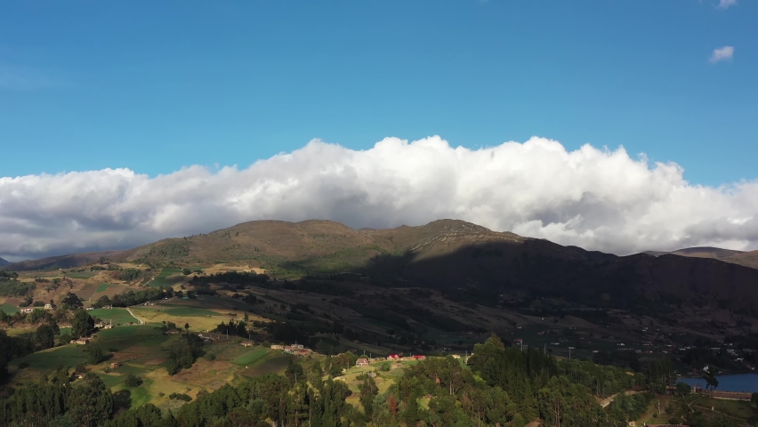 Drone Aerial View of Scenic Landscape of Colombia Highlands by Lake Tota. Boyaca Region on Beautiful Sunny Day, Revealing Drone Shot