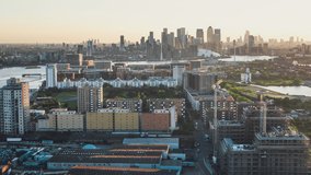 Establishing Aerial View Shot of London UK, City skyline, magnificent blast, East, United Kingdom, from Silvertown
