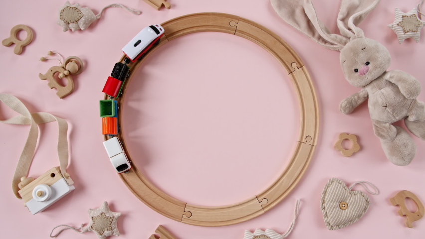 Childish Toy Wooden Railway. Toy Train Travel Along the Ring Railway. Child's Educational Toys. Top View. Copy Space. | Shutterstock HD Video #1075551578