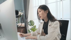 Asian business woman meeting in video call by computer .Work from home concept.