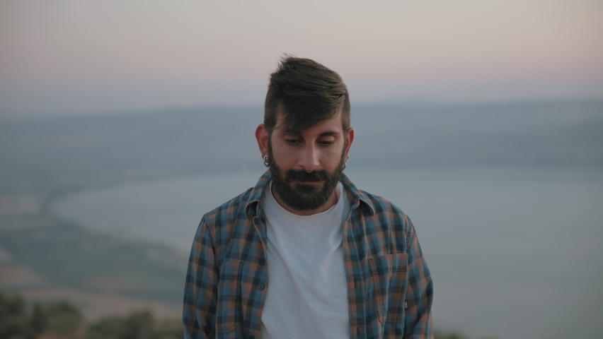 Portrait of a middle eastern man looking to the camera. Slow motion, medium shot.
