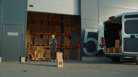 Logistics Warehouse Mock-up Drone Delivery Concept: Female Worker Using Tablet Computer and Tracking Markers for Drone to Pick Up Cardboard Box for Aerial Delivery. e-Commerce Online Orders