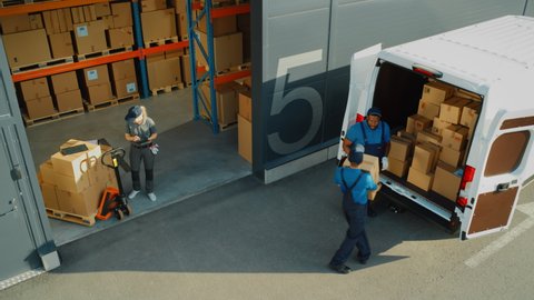 Outside of Logistics Retailer Warehouse With Manager Using Tablet Computer, Workers Start Loading Delivery Truck with Cardboard Boxes. Online Orders, Purchases, E-Commerce Goods. High Angle Shot