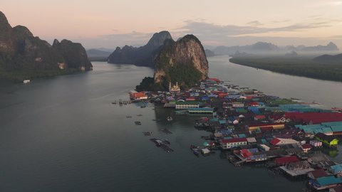 4K UHD Aerial view over Ko Panyi island near Phuket floating village in souther of Thailand. Ko Panyi is a fishing village in Phang Nga Province, Thailand.