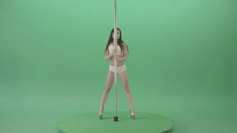 Pole Dance sport girl waving sexy body. Fit pole dancer girl in white underwear performing a rousing contemporary dance moves on pylon on green chromakey background.