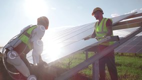 Zoom in view of male engineer in exoskeleton lifting photovoltaic cell while assembling solar panel with colleague on sunny day on power station - Powered by Shutterstock - Get 15% off with code: PIKWIZARD15