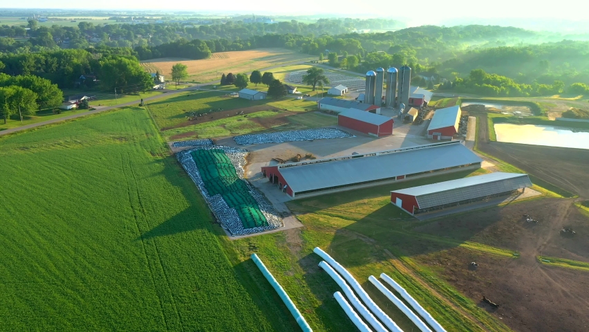 Scenic flyover of rural Wisconsin farming landscape with breathtaking scenery at sunrise.
