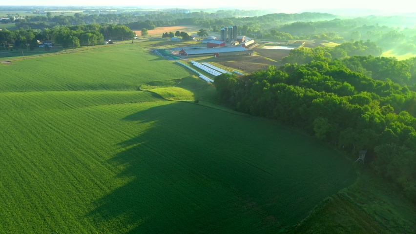 Time lapse flyover of rural Wisconsin farming landscape with breathtaking scenery at sunrise.
