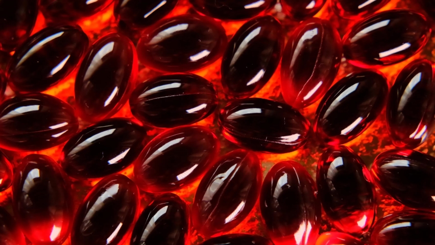 Red Krill oil  capsules background. Rotation.omega fatty acids. Royalty-Free Stock Footage #1075588913
