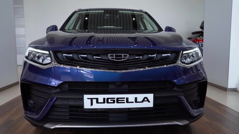 Moscow, Russia - June 1, 2021. Geely Tugella (front view). Car with Headlight Close up. Car Front Led Light with a Blurry Background. Car Headlights Led Lamp.