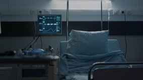 Empty hospital ward designed with medical equipment used as treatment for disease, illness, health problems. Intensive care room with medical tools, monitor, IV drip bag and oxygen tube - Powered by Shutterstock - Get 15% off with code: PIKWIZARD15