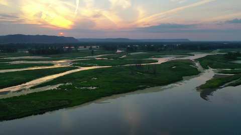 Mississippi river aerial view at sunset. Minnesota Wisconsin border, near La Crosse. Summer, beautiful evening landscape, drone flying over the water