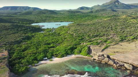 Aerial view above scenery of Curacao, the Caribbean with hills, mountains, ocean