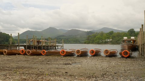 7th July 2021. Keswick, Cumbria, England. Rowing boats and ducks at the side of Derwent Water.