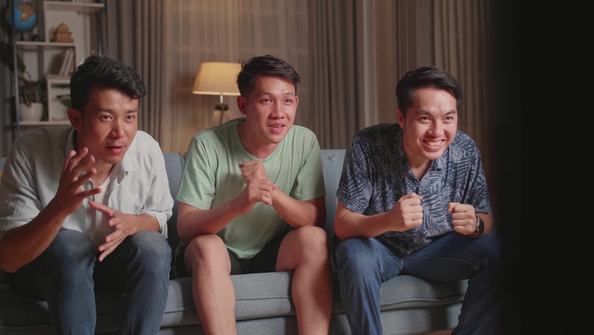 Three Asian Males Cheering And Watching Football Game On Tv And Celebrating Victory At Home
 Royalty-Free Stock Footage #1075628144