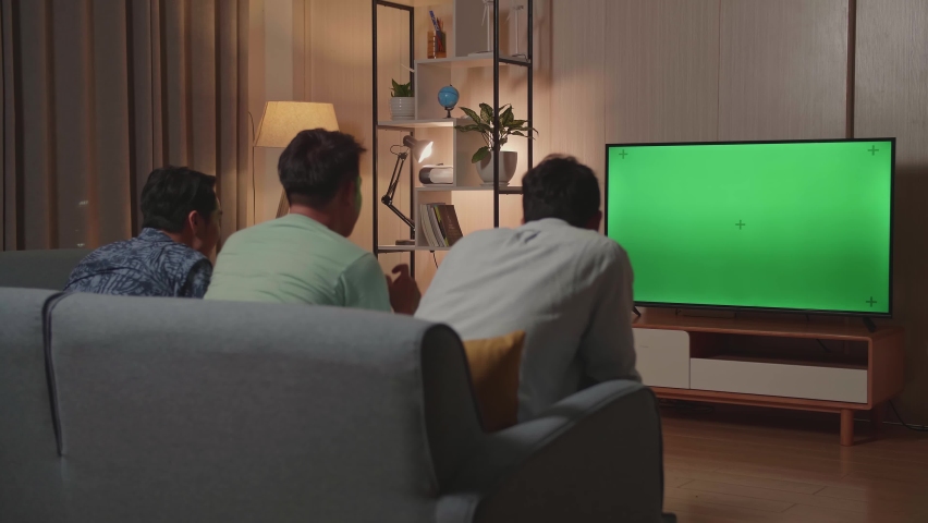 Happy Time Of Young Friends Cheering And Watching Green Screen Tv And Celebrating Victory At Home
 | Shutterstock HD Video #1075628171