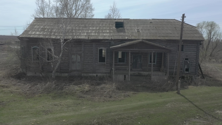 a destroyed village house in the spring-devastation and an abandoned village in russia aerial view