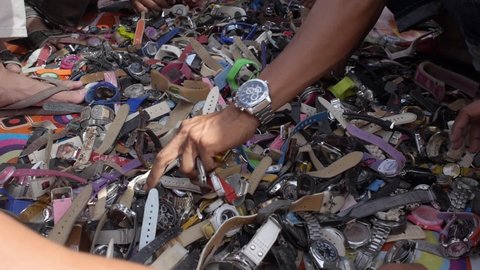 Yala, Thailand Dec 12, 2015: Flea market second hand watches people search pick and check old mechanical and electric watch